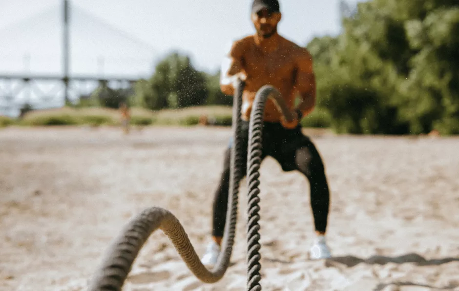 Guy using battle rope
